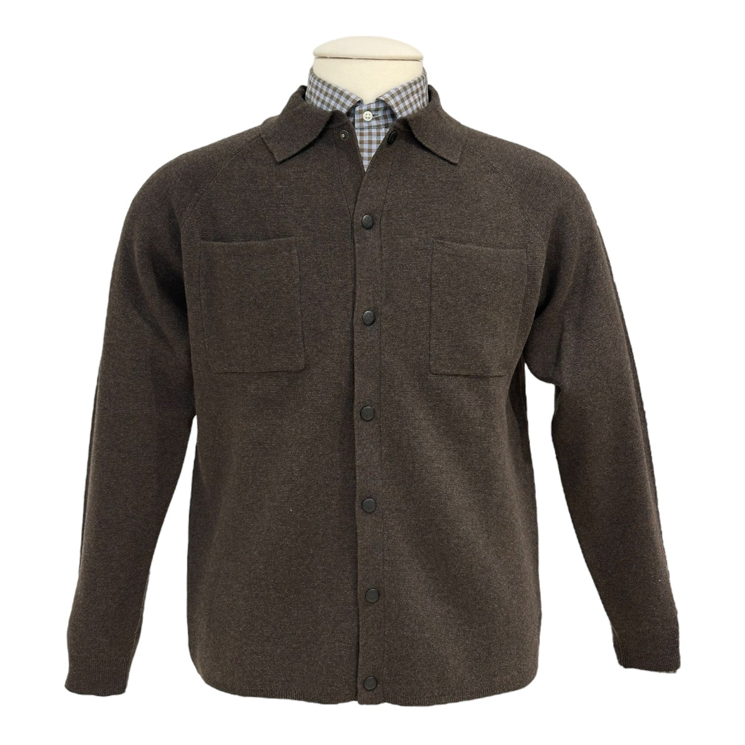 The Alan Paine Ashcroft Knit Polo is styled beneath a brown button-up shirt jacket with two chest pockets, shown on a mannequin for a sharp, modern look.