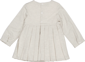 The Girls' Ashley Organic Cotton Twill Dress by Kidiwi is a cream-colored, long-sleeve children's dress with pleats and back buttons, shown from the back.