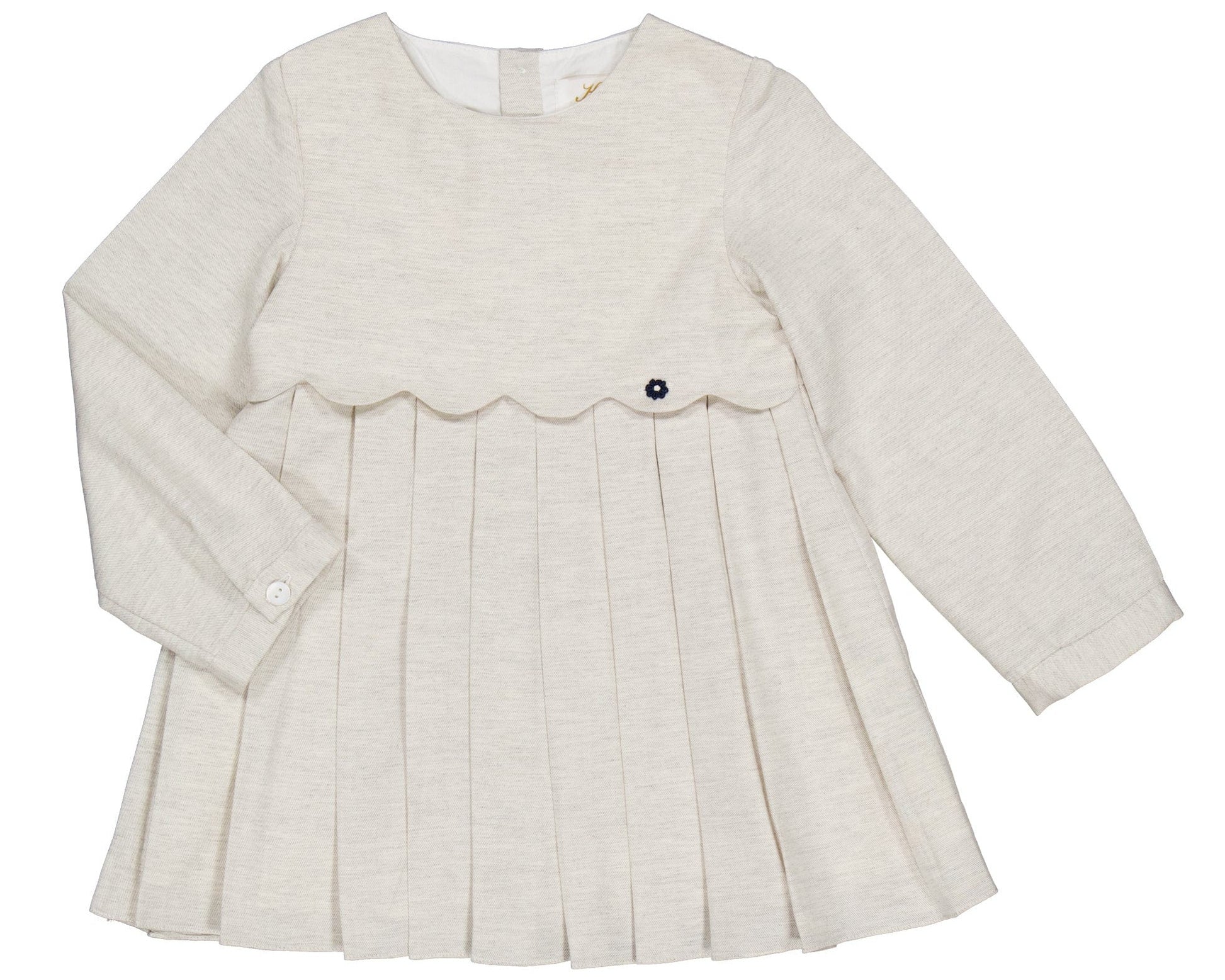The Kidiwi Girls' Ashley Organic Cotton Twill Dress is a cream long-sleeve style for young children, featuring a pleated skirt, scalloped bodice detail, and a decorative button.