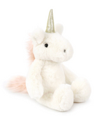 Shyla Unicorn - Cream by Mon Ami is a premium plush toy featuring a shiny holographic horn, black eyes, and a fluffy light pink tail. This plush white unicorn sits upright against a plain white background.
