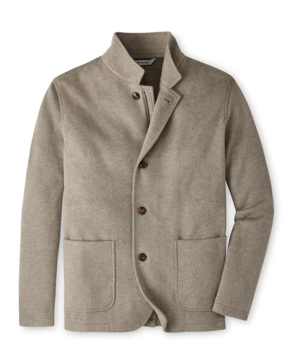 Peter Millar Crown Flex Merino Blazer in taupe with a stand collar, three buttons, and two front patch pockets.