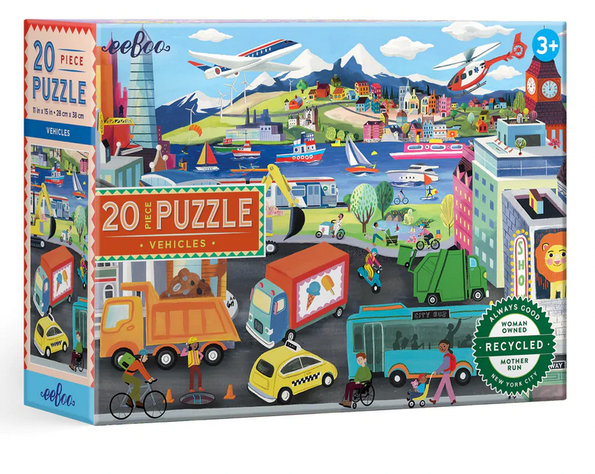 Eeboo Vehicles 20-Piece Puzzle features a vibrant city scene filled with vehicles, people, boats, and buildings. Designed for children ages 3 and up, this puzzle comes in eco-friendly packaging.