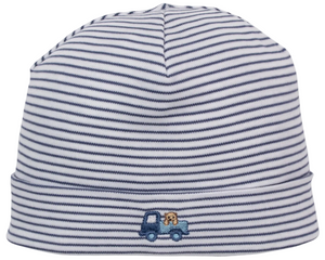 The Bears on the Go Striped Hat by Kissy Kissy is a white baby cap crafted from soft Pima cotton, featuring thin navy blue horizontal stripes and a small blue truck with a dog embroidered on the front cuff.