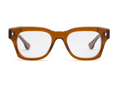 The Caddis Muzzy Reader is a pair of rectangular, brown bio-based acetate eyeglasses with scratch-resistant clear lenses, shown from the front against a white background.