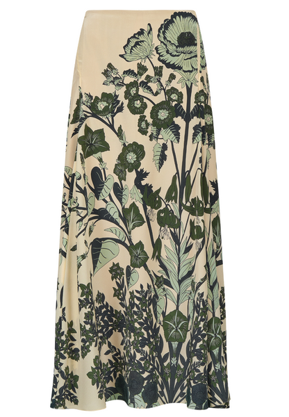 The Poems of the Sea Ankle Skirt by Johanna Ortiz is a beige silk midi skirt with a striking green and black botanical print of large flowers and leaves.