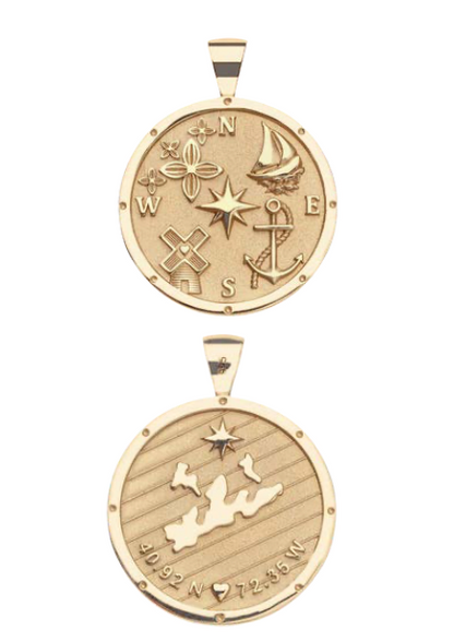 The Jane Win Destination Pendant Necklace Collection features two gold necklaces: one with a compass rose, sailboat, anchor, and more; the other engraved with a map, coordinates, and a star.