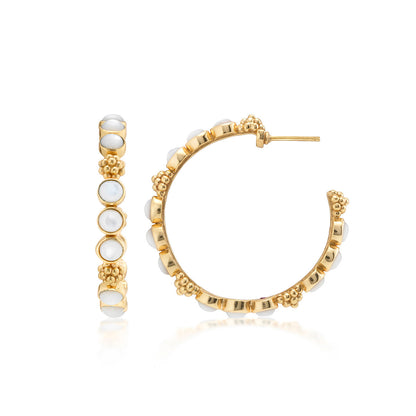 The Juliska Capucine De Wulf Berry Gem Medium Hoop Earrings showcase small white stones and gold beading, pictured in front and side views against a white background.
