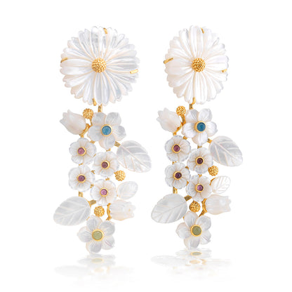 The Juliska Capucine De Wulf Mermaid Garden Convertible Statement Earrings feature carved white mother of pearl flowers and leaves with gold accents and pastel gemstone centers.
