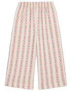 Girls’ Ysalia Sweatpant by Louise Misha features a wide-leg silhouette with a floral print of vertical pink stripes on a cream background and an elasticated waist for added comfort.