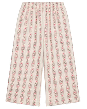 Girls’ Ysalia Sweatpant by Louise Misha features a wide-leg silhouette with a floral print of vertical pink stripes on a cream background and an elasticated waist for added comfort.