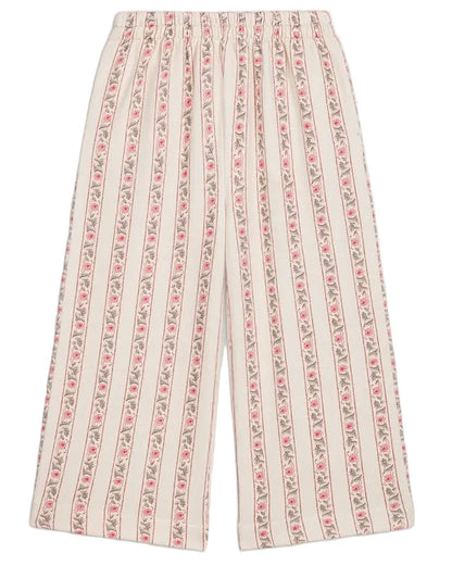Girls’ Ysalia Sweatpant by Louise Misha features a wide-leg silhouette with a floral print of vertical pink stripes on a cream background and an elasticated waist for added comfort.
