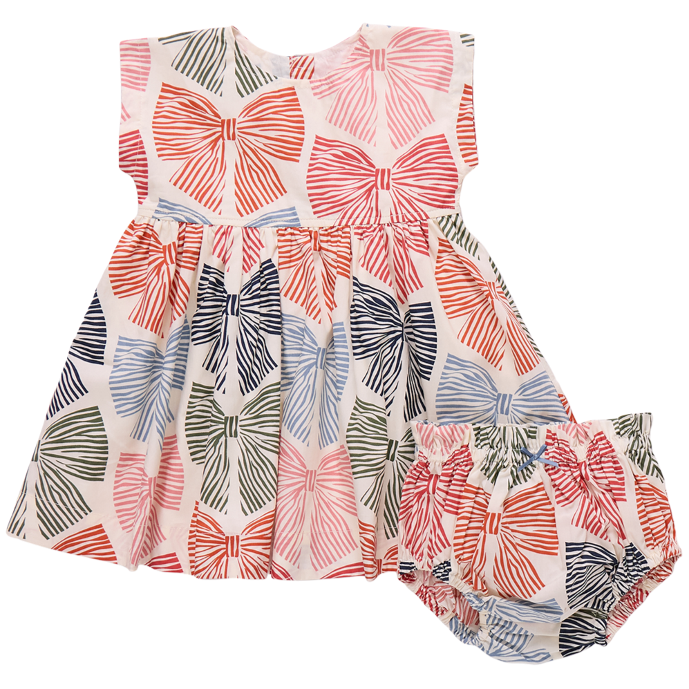 The Baby Girls' Adaline Dress Set by Pink Chicken features coordinating bloomers, both with vibrant red, pink, blue, and green multi-striped bows on white.