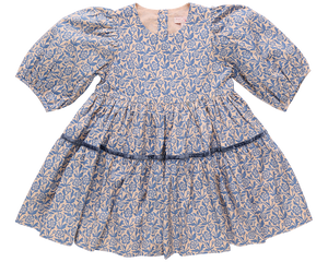 The Girls' Maribelle Dress by Pink Chicken features soft cotton poplin with a blue climbing floral print on light pink, puffed sleeves, round neckline, and a gathered tiered skirt.