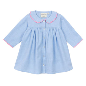 The Arsene & Les Pipelettes Baby Girls' Giovana Dress is a light blue long-sleeve dress with a scalloped pink-trimmed collar and front buttons—perfect for your little one's special moments.