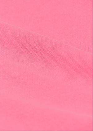 Close-up of the Arsene & Les Pipelettes Baby Girls' Guadalupe Fluo Fleece Cardigan in pink, showcasing its textured fabric and horizontal folds—ideal for a cozy and stylish baby outfit.