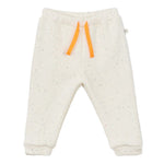 The Arsene & Les Pipelettes Baby Gabano Speckled Joggers feature white speckled fleece, an elastic waistband, and orange drawstrings, shown on a plain white background.