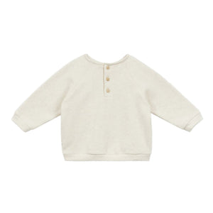 The Arsene & Les Pipelettes Baby Gideon Embroidery Sweatshirt is a cream-colored, long-sleeved toddler pullover with a round neck and three front buttons.