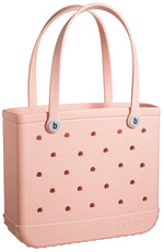 This pink Baby Bogg Bag from Bogg Bags is durable and washable with holes.