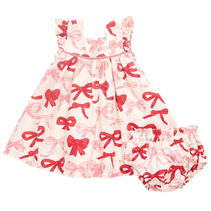 Introducing the Pink Chicken Baby Girls' Camelia Dress Set, a sleeveless dress with matching bloomers, featuring a charming print of Valentine's bows on a white background.