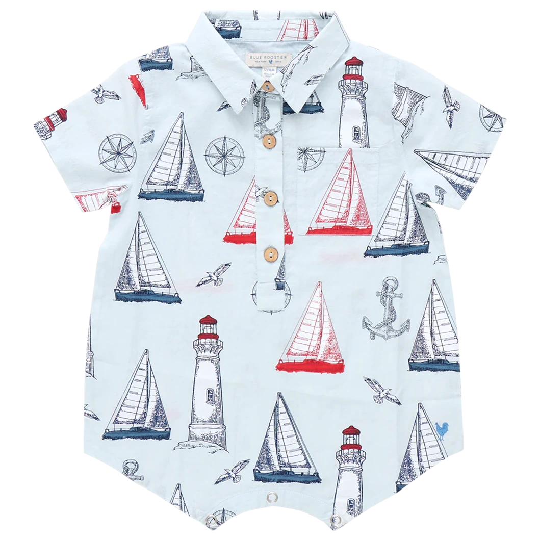 Set sail in the Pink Chicken Baby Boys' Easton Jumper—a collared short-sleeve romper decorated with playful sailboats, lighthouses, anchors, and compasses in vibrant red, blue, and white.