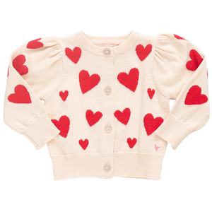 Explore the Pink Chicken Baby Girls' Constance Sweater, a classic cream cardigan adorned with red heart patterns, charming puffy sleeves, and a glitter button front for added sparkle.