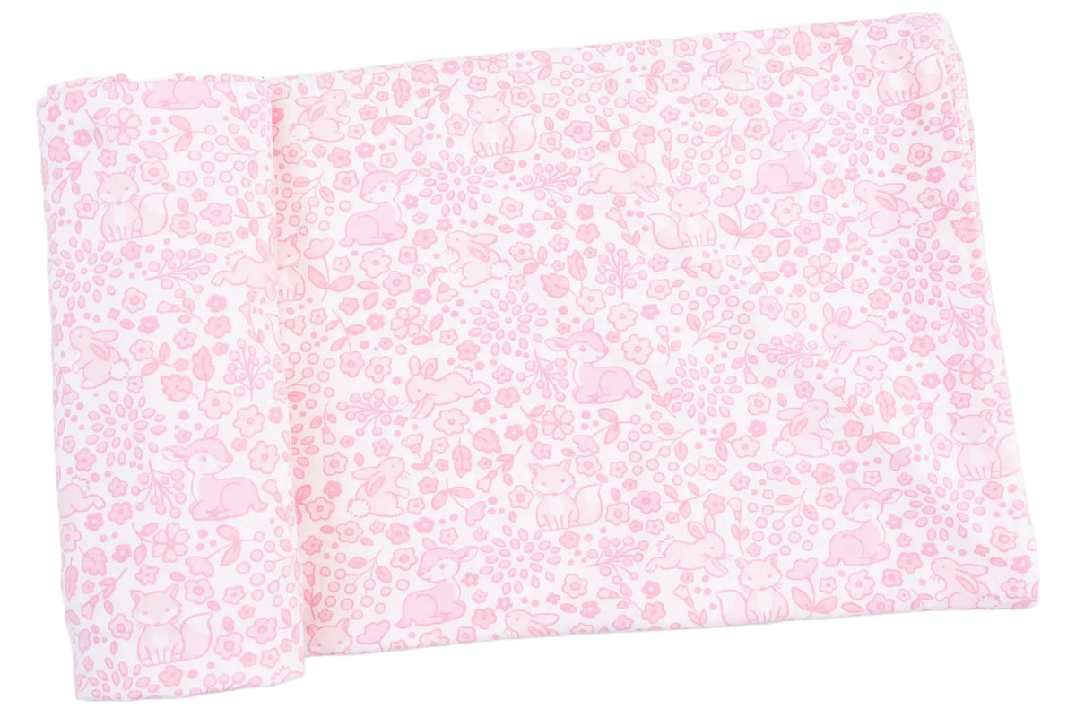 A folded pink Swaddle Blanket from Angel Dear showcases a charming animal and floral pattern with rabbits and deer among flowers and leaves. Crafted from ultra-soft viscose from bamboo, this baby blanket offers gentle comfort for your little one.