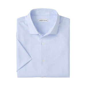 The Peter Millar Baldwin Performance Sport Shirt is light blue, short-sleeve, features a subtle geometric pattern, two-way stretch, and has a label inside the collar.