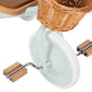 Close-up of the Banwood Kids’ Trike front white wheel, featuring wooden pedals and a charming wicker basket attached above the wheel.