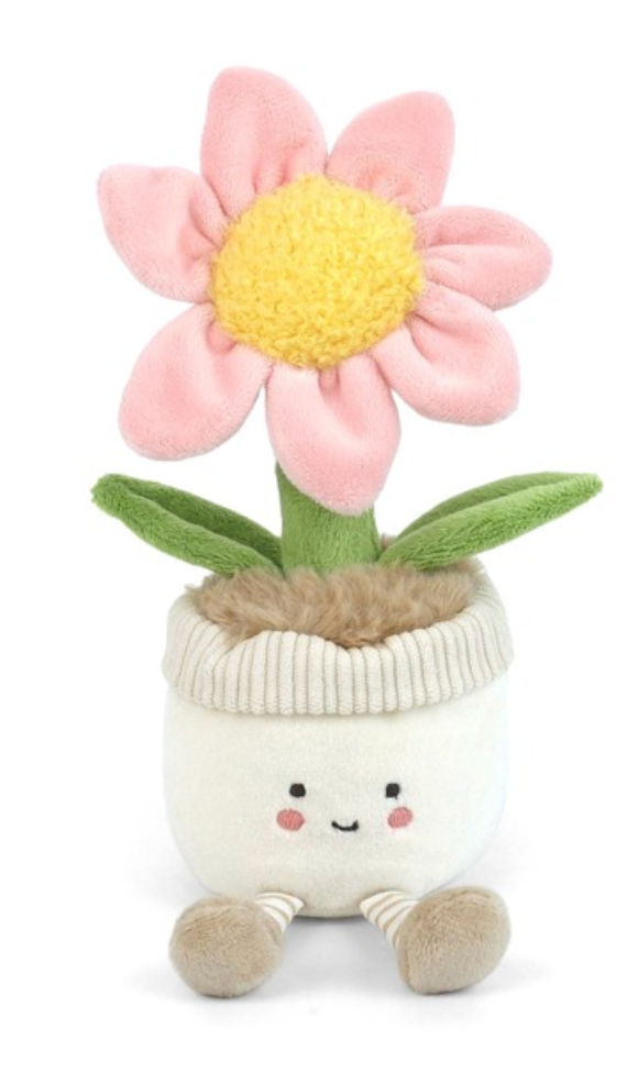 Petunia Puff by Mon Ami is a plush flower toy shaped like a flowerpot, featuring a smiling face, pink flower, green leaves, and beige legs. Sitting upright against a white background, it’s a charming addition to any garden-themed decor.