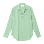 The Xirena Beau Shirt is a light green, long-sleeve boyfriend shirt made from soft cotton poplin, shown laid flat on a white background.
