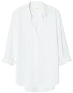 A white Xirena Beau Shirt made of Cotton Poplin on a swinger.