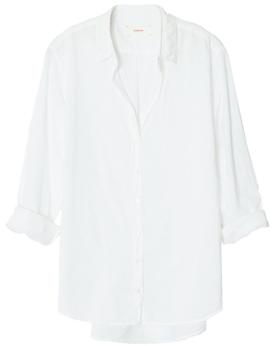 A white Xirena Beau Shirt made of Cotton Poplin on a swinger.