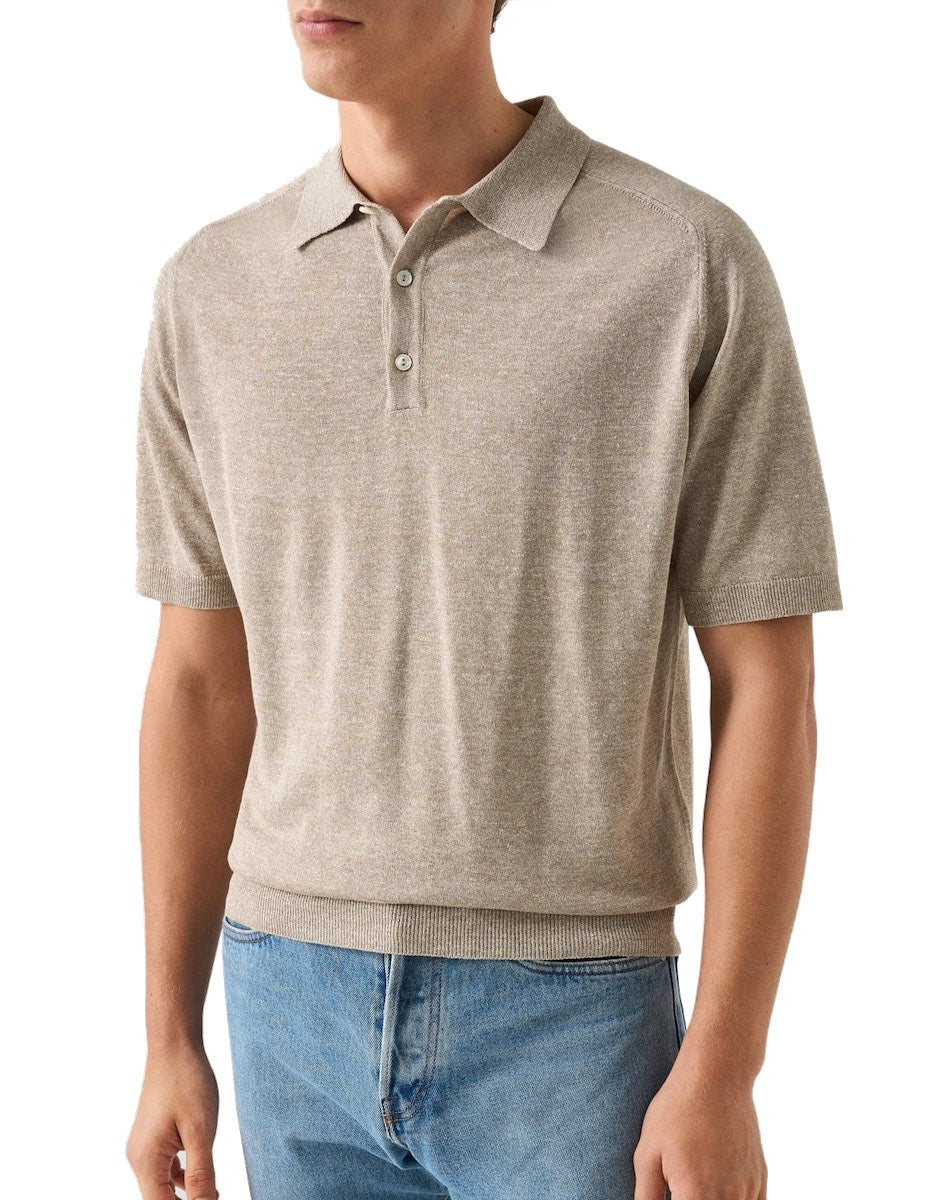 A person wearing the Eton Beige Cotton Linen Polo with blue jeans, shown from the waist up against a plain background.