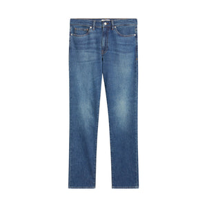 Introducing the L’Homme Slim Denim by Frame—a pair of slim-fit blue jeans made from stretch denim, designed with a classic button and zip closure, functional front and back pockets, and subtle fading at the thighs for a comfortable yet tailored look.