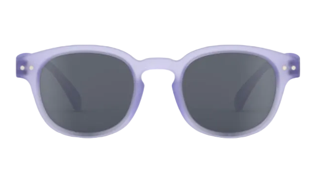 A pair of IZIPIZI Kids’ #C Polarized Sunglasses featuring an ergonomic design, round dark lenses, and a translucent light purple frame, displayed against a white background.
