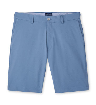 The Peter Millar Matlock Seersucker Performance Short in light blue is shown flat on a white background, highlighting its button closure, belt loops, and side pockets.