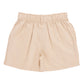 The Boys’ Jackson Short by Pink Chicken is a beige, high-waisted style for boys featuring belt loops and an elastic waistband, crafted from comfortable cotton canvas and shown flat against a white background.