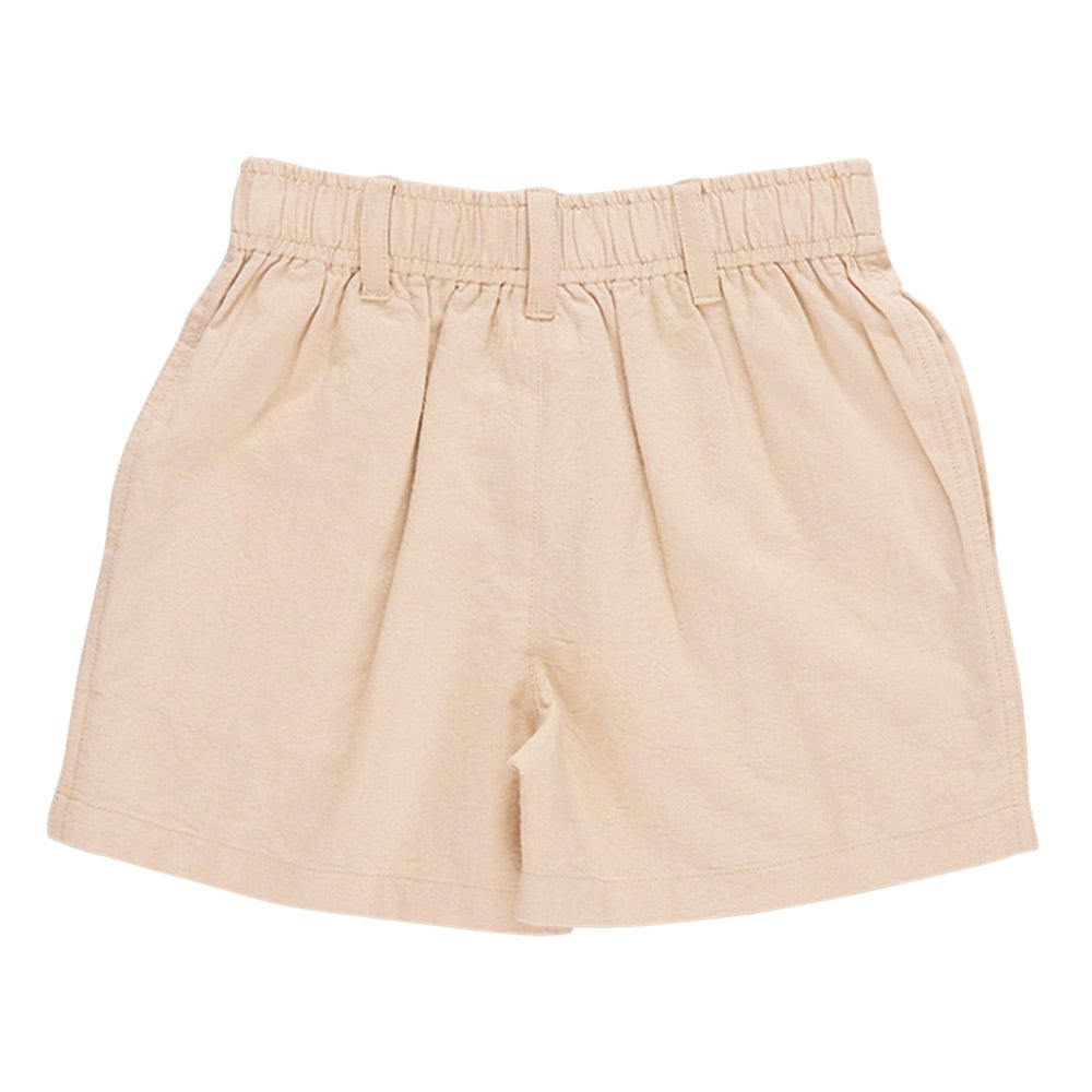 The Boys’ Jackson Short by Pink Chicken is a beige, high-waisted style for boys featuring belt loops and an elastic waistband, crafted from comfortable cotton canvas and shown flat against a white background.