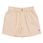 The Boys’ Jackson Short by Pink Chicken features beige cotton canvas, an elastic waistband, button closure, belt loops, and a small blue embroidered logo near the left hem.