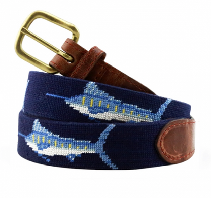 Introducing the Smathers & Branson Billfish Belt in Navy, a meticulously crafted piece by Smathers & Branson. This belt showcases marlin fish embroidery on navy blue needlepoint, complemented by a brass buckle and luxurious brown Italian leather accents—ideal for any outfit with an outdoorsman theme.