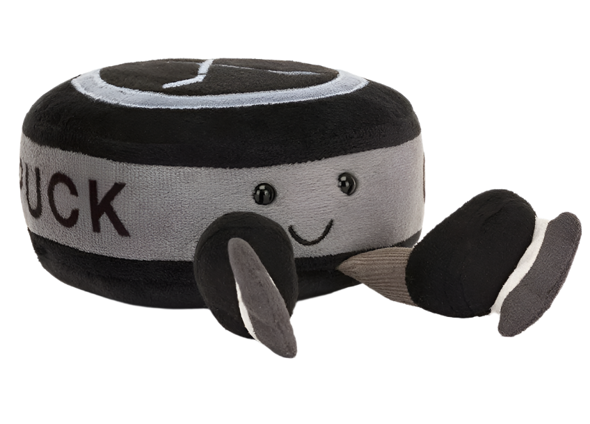 Introducing the Jellycat Amuseables Sports Ice Hockey Puck, a plush toy designed as a puck with a cheerful face, tiny eyes, and black-gray fins. It includes delightful embroidered hockey sticks and faux-suede skates for added playfulness.