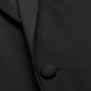 Close-up of a Samuelsohn Garner Classic Fit Tuxedo in black, crafted from luxurious Super 150's fabric, highlighting a single button and a section of the lapel—ideal for any formal occasion.