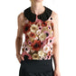 A woman wears the Dorothee Schumacher Blooming Meadow Top, featuring floral 3D embroidery and a black Peter Pan collar, styled with a black skirt.