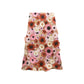 The Blooming Meadow Skirt by Dorothee Schumacher is a knee-length A-line midi with red, pink, and white floral 3D embroidery on sheer beige fabric for a couture-inspired look.