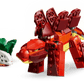 A red LEGO® stegosaurus from the Legos - Toyhouse LEGO® Creator 3-in-1 Fierce Dinosaur set stands next to a small white skeleton with green leaves.