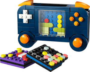 The LEGO® Creator 3-in-1 Retro Gaming Console from Legos - Toyhouse features interchangeable pixelated game screens and orange control buttons—ideal gamer room decor for fans of creative building sets.