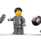 Three minifigures with a tablet, gray outfit, and helmet gather by the LEGO® City F1® Display Truck with Audi F1® Race Car building kit from Legos - Toyhouse.