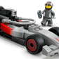 Build your collection with the LEGO® City F1® Display Truck with Audi F1® Race Car by Legos - Toyhouse, featuring a race car with Audi logo, red and black details, and a minifigure driver in a gray racing suit with helmet and wrench.