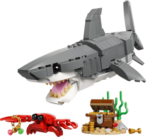 The LEGO® Creator 3-in-1 Fierce Shark with a Treasure Chest by Legos - Toyhouse includes a gray shark, red crab with a gold coin, and treasure chest for imaginative sea adventures.