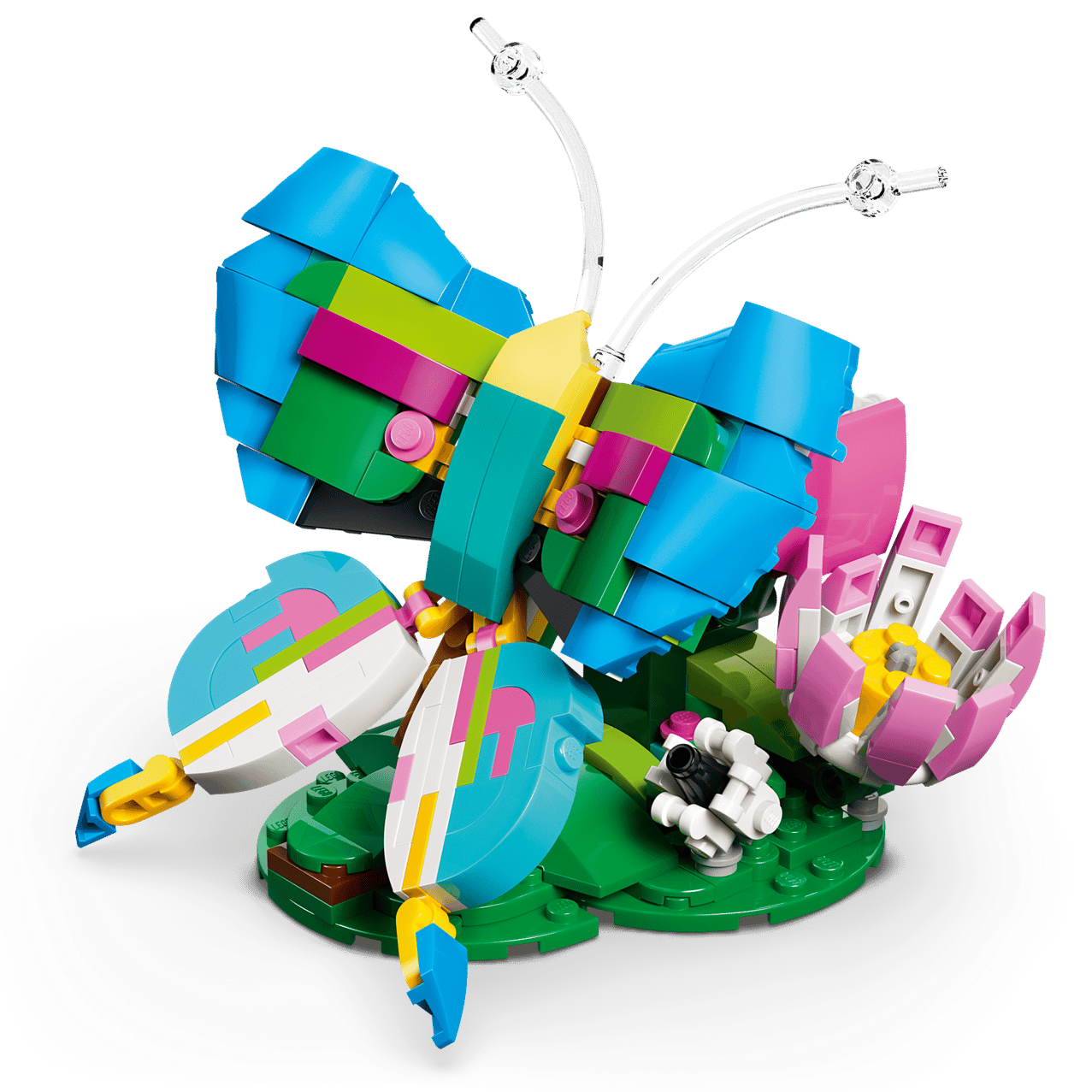 The LEGO® Creator 3-in-1 Wild Animals: Colorful Hummingbird by Legos - Toyhouse features a vibrant hummingbird with blue, yellow, pink, and green wings perched on a green base with a pink and white flower.